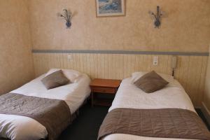 Postel nebo postele na pokoji v ubytování Hotel De La Mer