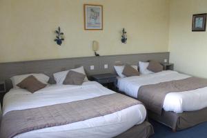 Postel nebo postele na pokoji v ubytování Hotel De La Mer