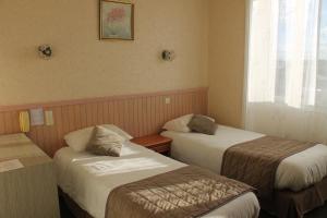 Postel nebo postele na pokoji v ubytování Hotel De La Mer