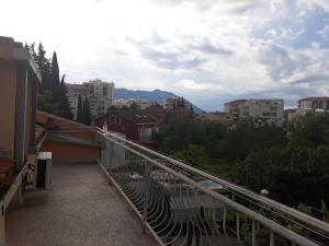 a view of a city from a balcony at Guest House Olga in Budva
