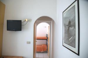a hallway with a picture of a horse on the wall at Hotel Annarita-mezza pensione plus- spiaggia inclusa in Rimini