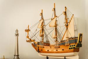 a model of a wooden ship on display at Theaktis Homes in Kaloi Limenes