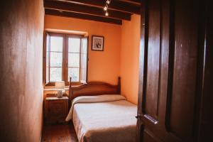 Säng eller sängar i ett rum på Carquera Casa a 8 Km de Nava