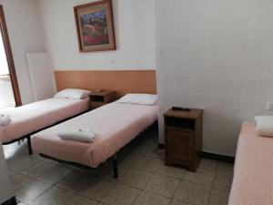 Postel nebo postele na pokoji v ubytování Pensión Fortea
