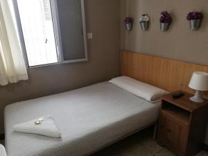 Postel nebo postele na pokoji v ubytování Pensión Fortea