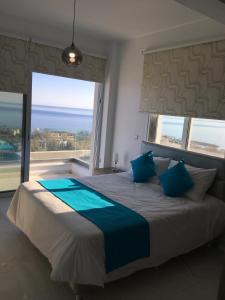 Ένα ή περισσότερα κρεβάτια σε δωμάτιο στο Elite Sea View Villa