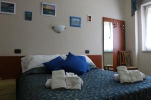 A bed or beds in a room at B&B Gattopardo