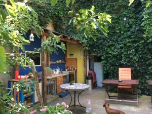a kitchen with a table and a table and a chair at Hostel Del Mar in Varna City