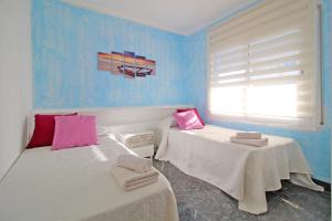 Apartamento Playa Doradaにあるベッド