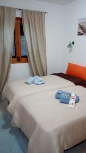 Postel nebo postele na pokoji v ubytování Residencial Sol Suite 2