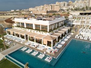 an aerial view of a resort with a pool at La Siesta Hotel & Beach Resort in Khaldah