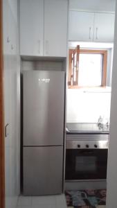 Kuchyň nebo kuchyňský kout v ubytování Residencial Sol Suite 2