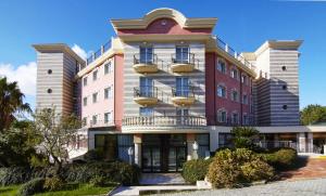 a building with a balcony on the side of it at San Giovanni Rotondo Palace - Alihotels in San Giovanni Rotondo