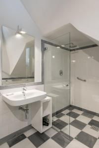 a bathroom with a sink and a shower at Casa Temprado in Seville