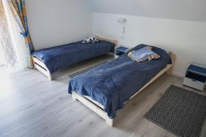 Posteľ alebo postele v izbe v ubytovaní AZURIA agroturystyka