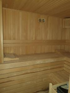 a wooden sauna with two beds in it at panaroma villaları in Alanya