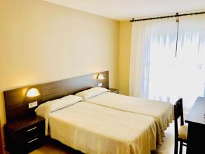 Katil atau katil-katil dalam bilik di Hotel Susuqui