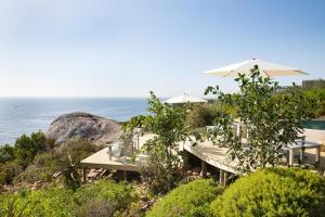 a resort with a view of the ocean at Watercolours Studios in Simonʼs Town