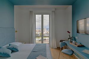 Postel nebo postele na pokoji v ubytování Hotel Aristeo