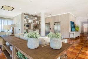 a living room with a couch and a table at Mirachoro Carvoeiro in Carvoeiro