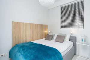 Posteľ alebo postele v izbe v ubytovaní Elite Apartments Downtown Premium