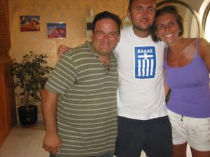 two men and a woman posing for a picture at Amaryllis Hotel in Karpathos