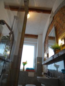 a bathroom with a sink and a window at Villa "Schöni" in Senftenberg