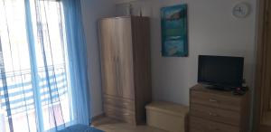 TV a/nebo společenská místnost v ubytování Casa Vacanze Trinacria