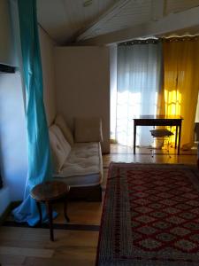 a living room with a couch and a table at Tour Duguesclin in Chauvigny