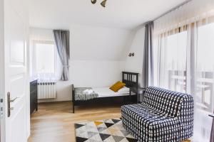 Posteľ alebo postele v izbe v ubytovaní Apartamenty GÓRKA