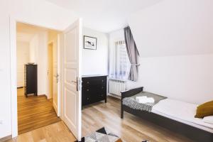 Posteľ alebo postele v izbe v ubytovaní Apartamenty GÓRKA