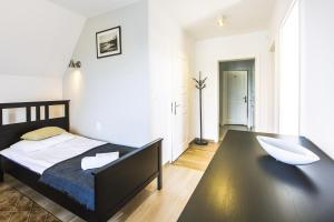 Posteľ alebo postele v izbe v ubytovaní Apartamenty GÓRKA