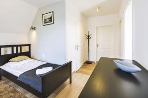 Posteľ alebo postele v izbe v ubytovaní Apartamenty GÓRKA