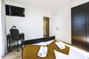 Posteľ alebo postele v izbe v ubytovaní Apartamenty GÓRKA