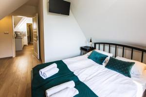 Posteľ alebo postele v izbe v ubytovaní Apartamenty GÓRKA