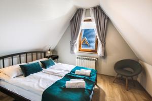 Posteľ alebo postele v izbe v ubytovaní Apartamenty GÓRKA