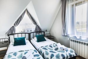 Posteľ alebo postele v izbe v ubytovaní Apartamenty GÓRKA