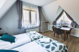 Posteľ alebo postele v izbe v ubytovaní Apartamenty GÓRKA