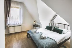 Posteľ alebo postele v izbe v ubytovaní Apartamenty GÓRKA