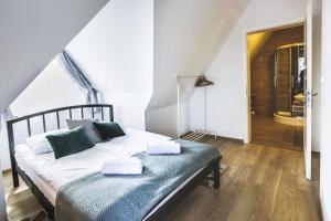Posteľ alebo postele v izbe v ubytovaní Apartamenty GÓRKA