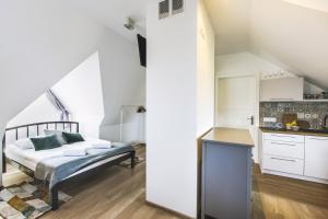 Posteľ alebo postele v izbe v ubytovaní Apartamenty GÓRKA