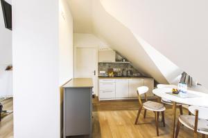 Kuchyňa alebo kuchynka v ubytovaní Apartamenty GÓRKA + 33 fotografií