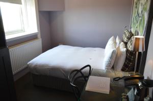 Postel nebo postele na pokoji v ubytování B+B Edinburgh