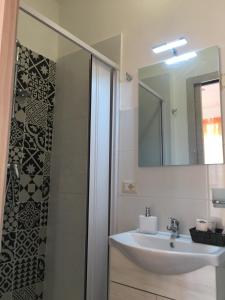 Ванная комната в Taormina’s Sun