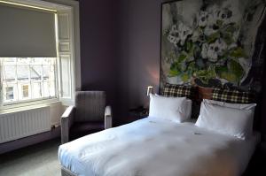 Postel nebo postele na pokoji v ubytování B+B Edinburgh