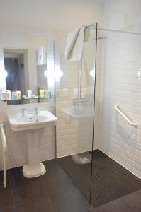 a bathroom with a sink, toilet and shower at B+B Edinburgh in Edinburgh