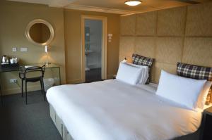 Postel nebo postele na pokoji v ubytování B+B Edinburgh