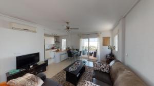 a living room with a couch and a kitchen at Marrajo 287334-A Murcia Holiday Rentals Property in Roldán