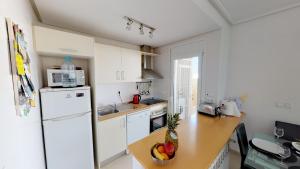 a kitchen with a white refrigerator and a counter at Marrajo 287334-A Murcia Holiday Rentals Property in Roldán