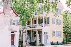 a large white house with a porch at Zero George Hotel in Charleston